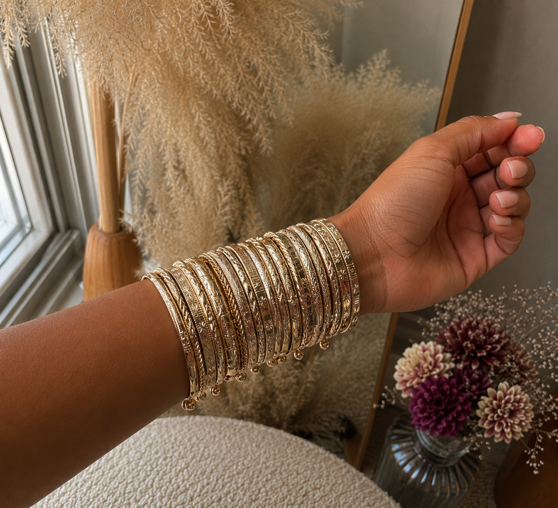 The Golden Hour Stack — ten warm gold bangles from Wmnly Co.